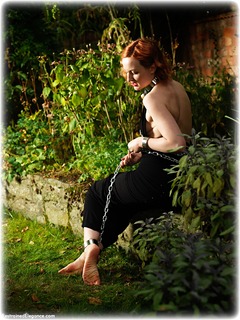 Bondage photo pic picture Anita deBauch barefoot, gown, shackles, sm factory, leg irons, chains, metal bondage, collar, outdoor, dress, ungagged, redhead