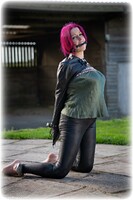 Free bondage photo Temptress Kate armbinder, satin, handcuffs, bit gag, silk, single glove, leg irons, metal bondage, outdoor, redhead