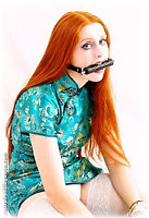Free bondage photo Gemma Craven handcuffs, bit gag, latex, leather bondage, chains, spanking, chinese dress, stockings, collar, corporal punishment, riding crop, whipping