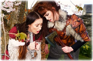 Bondage photo pic picture Sophia Smith and Zoe Page girlgirl, boots, brunette, lesbian, chains, medieval, metal bondage, outdoor, dress, ungagged, fiddle, redhead