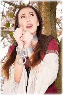 Bondage photo pic picture Sophia Smith and Zoe Page girlgirl, boots, brunette, lesbian, chains, medieval, metal bondage, outdoor, dress, ungagged, fiddle, redhead