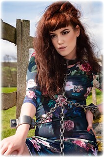 Bondage photo pic picture Zoe Page barefoot, shackles, leg irons, chains, metal bondage, collar, outdoor, dress, ungagged, redhead