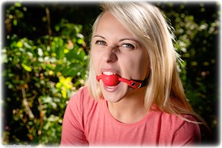 Bondage photo pic picture Chloe Toy ballgag, barefoot, handcuffs, blonde, jeans, leg irons, metal bondage, sweater, outdoor, denim