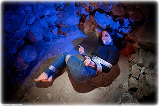 Bondage photo pic picture Charlie Monaco barefoot, jeans, brunette, sweater, tape bondage, tape gag, denim, topless, dungeon