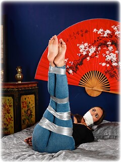 Bondage photo pic picture Lauren Rice barefoot, bedroom, blouse, bondage tape, jeans, brunette, casual clothes, lingerie, tape gag, denim, vet wrap