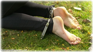 Bondage photo pic picture Stephanie Bonham Carter barefoot, handcuffs, blonde, blouse, hogtie, jodhpurs, leg irons, metal bondage, outdoor