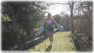 Bondage photo pic picture Lucy Lauren rope gag, blonde, shoes, spreader bar, cheerleader, pantyhose, uniform, dungeon