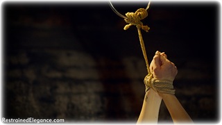 Bondage photo pic picture Lucy Lauren rope gag, blonde, shoes, spreader bar, cheerleader, pantyhose, uniform, dungeon