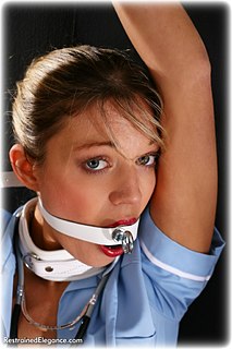 Bondage photo pic picture Belle ballgag, humiliation, leather bondage, stockings, collar, topless, uniform