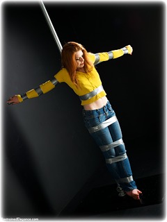 Bondage photo pic picture Helen Stephens barefoot, bondage pole, bondage tape, jeans, sweater, tape gag, ungagged, redhead