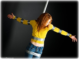 Bondage photo pic picture Helen Stephens barefoot, bondage pole, bondage tape, jeans, sweater, tape gag, ungagged, redhead