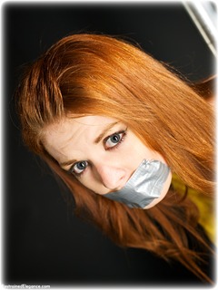 Bondage photo pic picture Helen Stephens barefoot, bondage pole, bondage tape, jeans, sweater, tape gag, ungagged, redhead