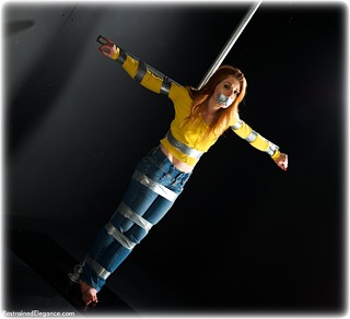 Bondage photo pic picture Helen Stephens barefoot, bondage pole, bondage tape, jeans, sweater, tape gag, ungagged, redhead