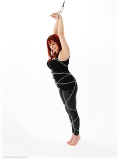 Bondage photo pic picture Temptress Kate barefoot, handcuffs, chains, metal bondage, ungagged, redhead