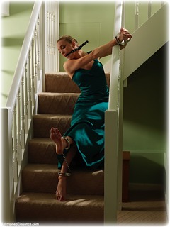 Bondage photo pic picture Katy Cee ballgag, ballgown, barefoot, gown, satin, handcuffs, blonde, silk, leg irons, metal bondage, dress, topless, ungagged