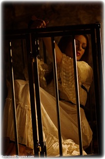 Bondage photo pic picture Penny Lee rope bondage, barefoot, historical, brunette, cage, medieval, dress, ungagged